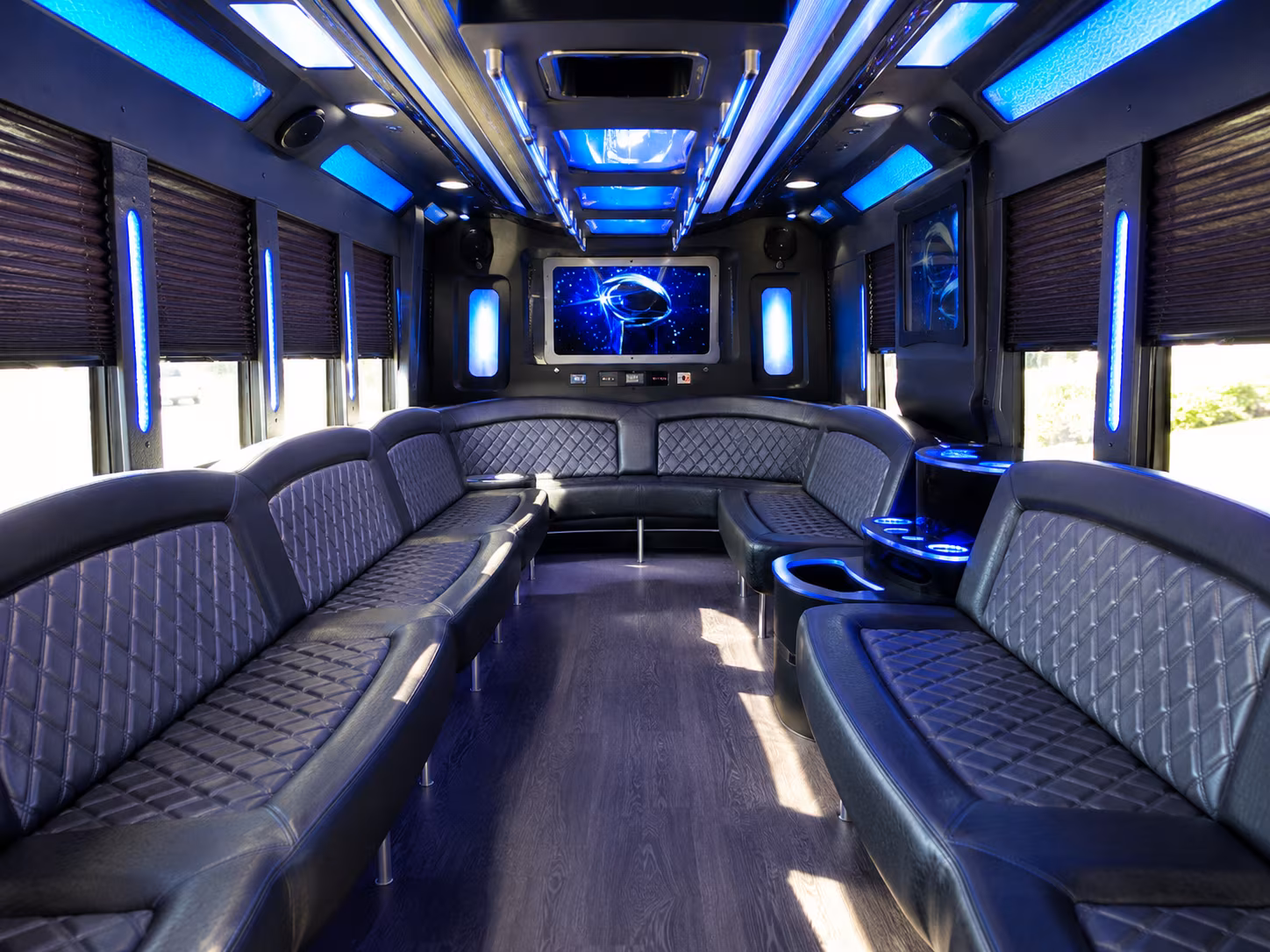 Wedding guests seated inside a party bus serving Boston